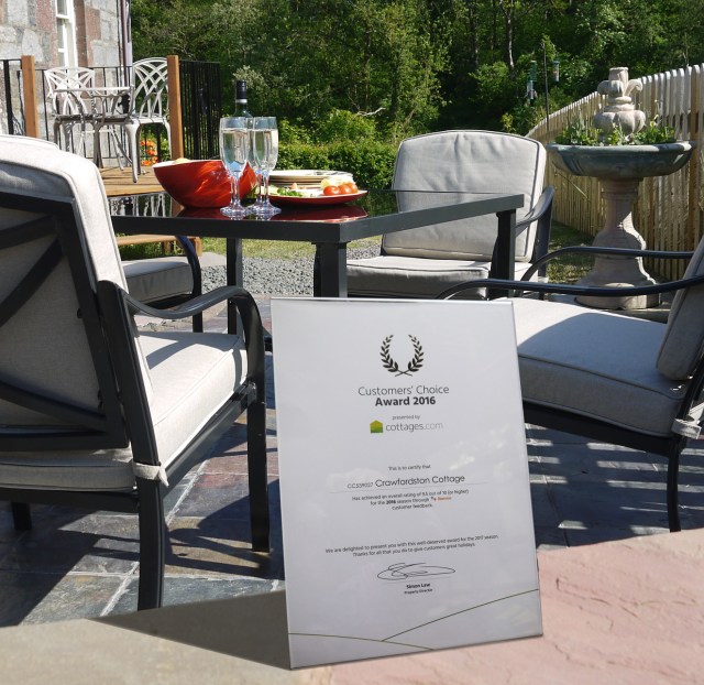 Award on display in front of cottage